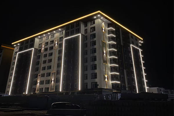 Seamless line of warm white linear light on a modern building